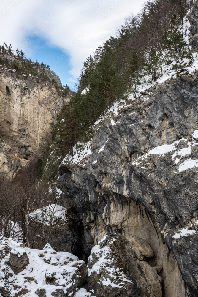 mountain gorge and river in the Caucasus mountains after snowfall 