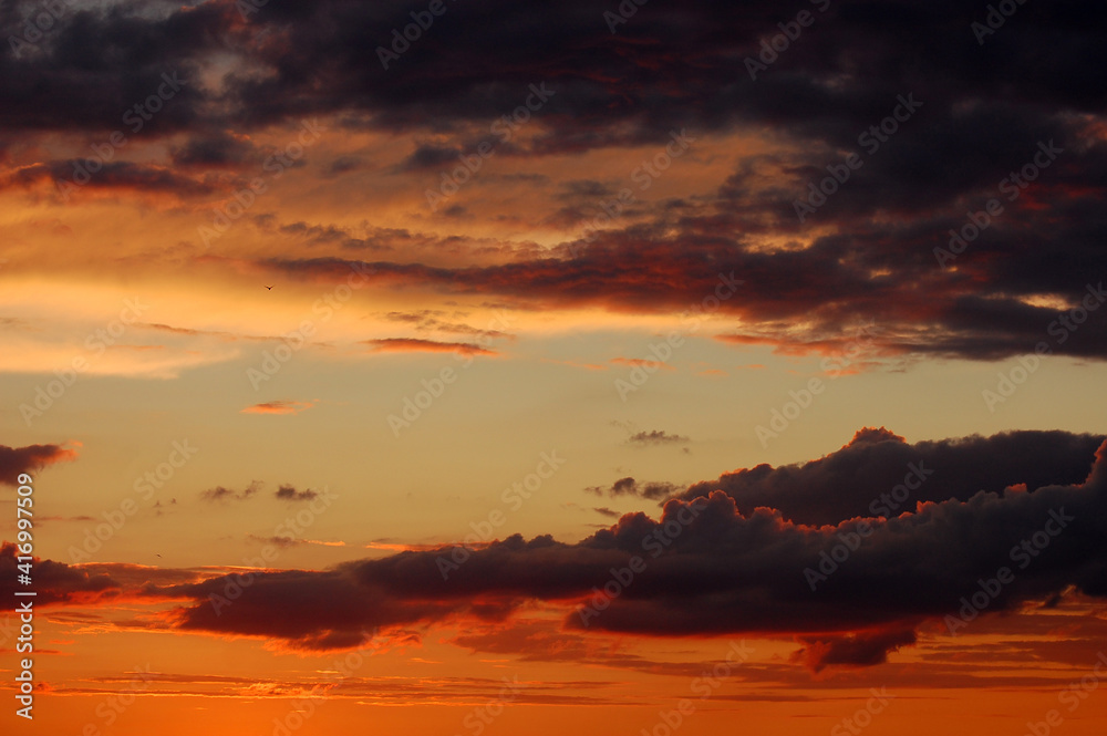 Dramatic sunset sky warm colors background