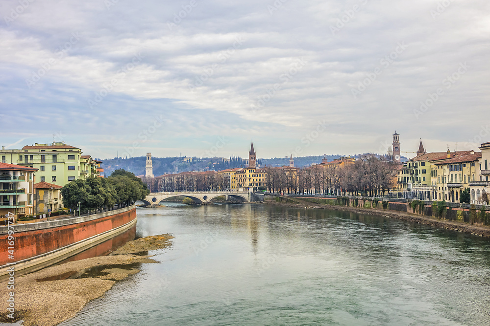 Obraz premium Beautiful panorama of Adige River waterfront in Verona, Italy.