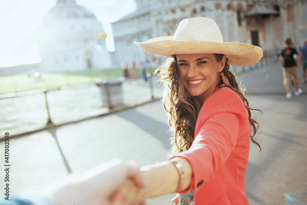 smiling trendy woman exploring attractions with boyfriend