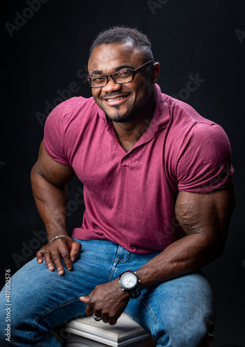 Cheerful successful young African American man studio portrait