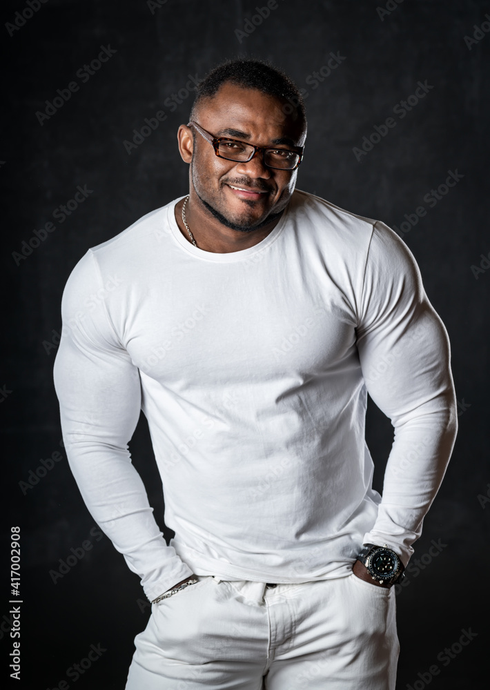 young African American man in studio in glasses young African American man in studio in glasses