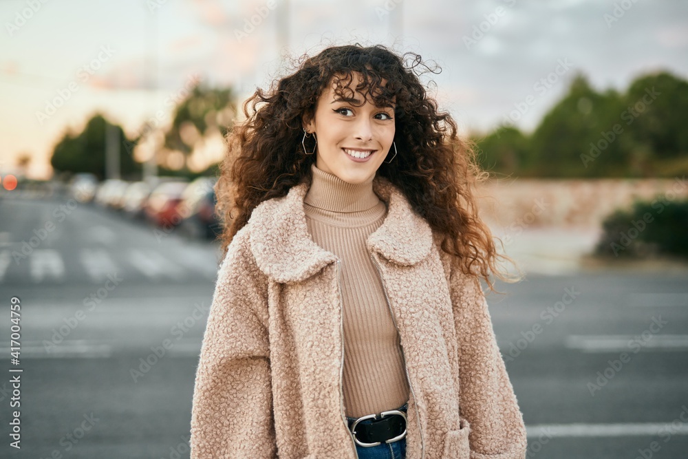 Young hispanic woman smiling happy standing at the city Young hispanic woman smiling happy standing at the city