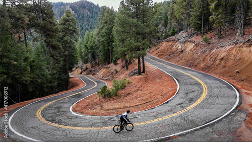 Cyclist on hairpin switchback photo