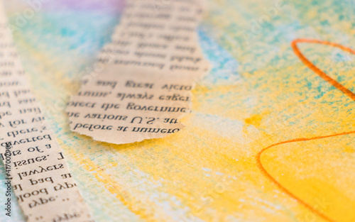 Abstract background in Yellow and Blue and pieces of book pages with unreadable  text