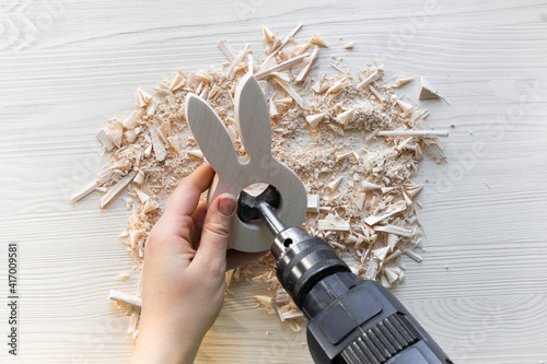 do it yourself: easter bunny - wooden egg stand. Step 5: hands drill with a large round drill bit to make a hole for the Easter egg