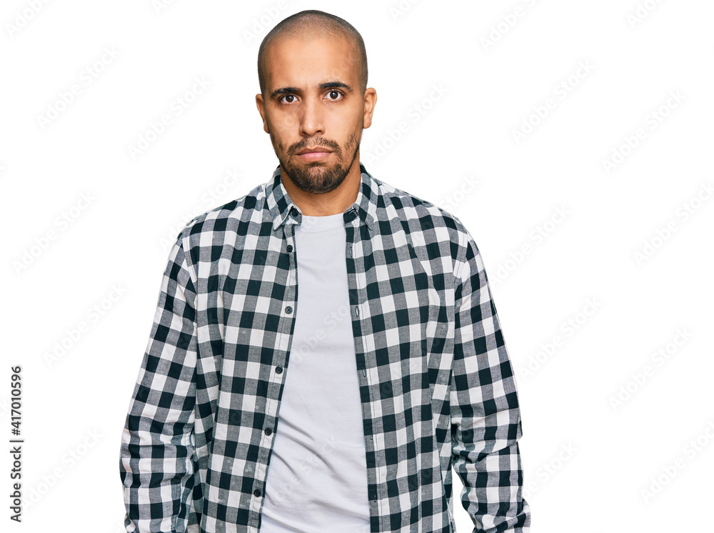 Hispanic adult man wearing casual clothes skeptic and nervous, frowning upset because of problem. negative person. Hispanic adult man wearing casual clothes skeptic and nervous, frowning upset because of problem. negative person.