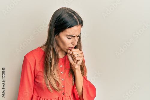 Young beautiful woman wearing casual clothes feeling unwell and coughing as symptom for cold or bronchitis. health care concept.