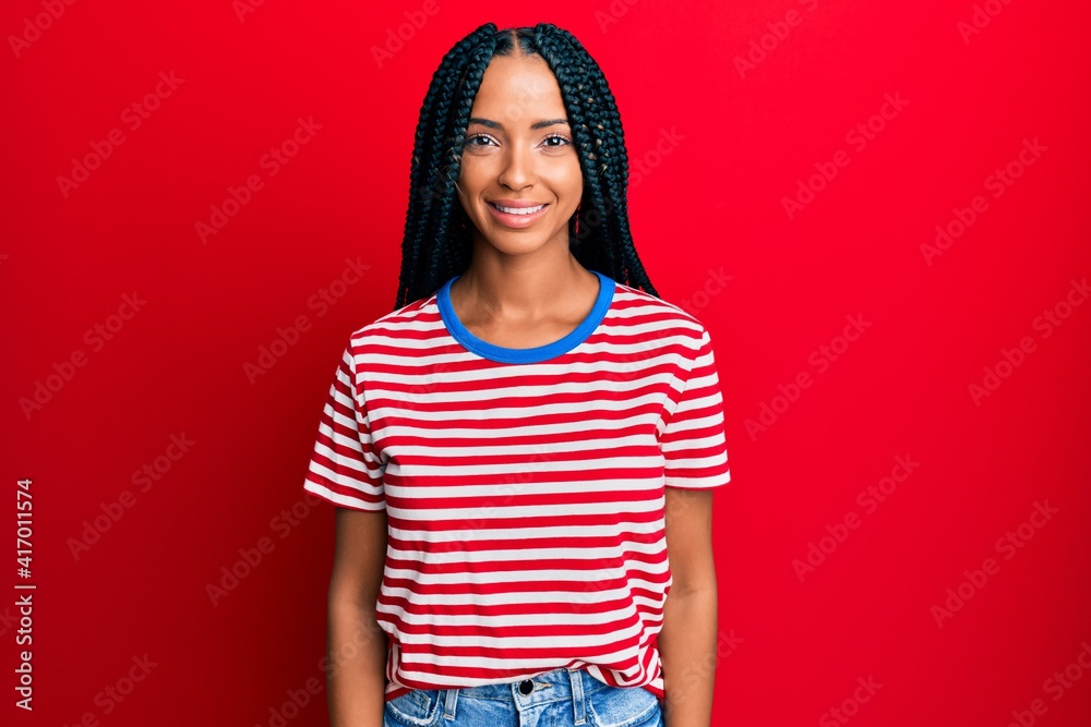 Beautiful hispanic woman wearing casual clothes with a happy and cool smile on face. lucky person. Beautiful hispanic woman wearing casual clothes with a happy and cool smile on face. lucky person.