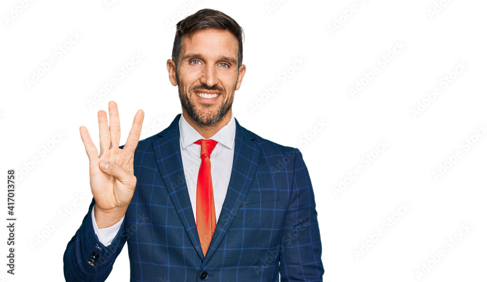 Handsome man with beard wearing business suit and tie showing and pointing up with fingers number four while smiling confident and happy. Handsome man with beard wearing business suit and tie showing and pointing up with fingers number four while smiling confident and happy.