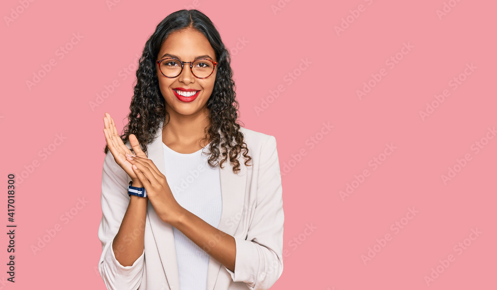 Young african american girl wearing business clothes clapping and applauding happy and joyful, smiling proud hands together