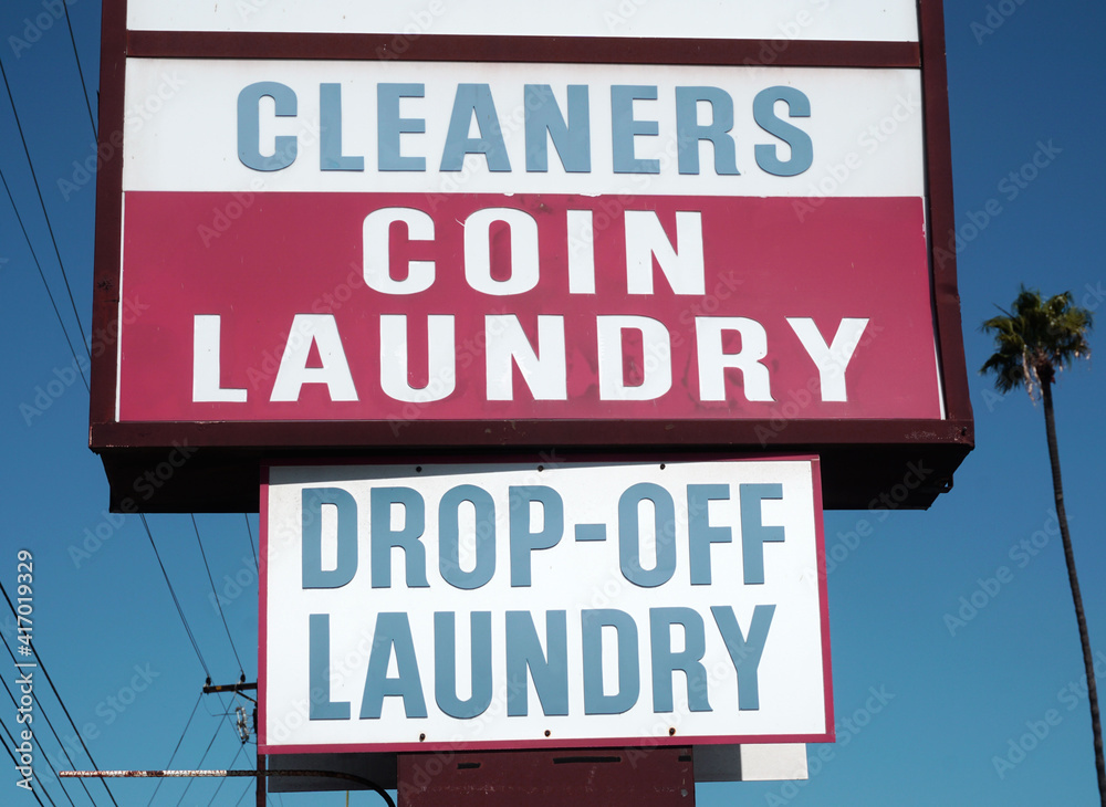 Old vintage coin laundry sign