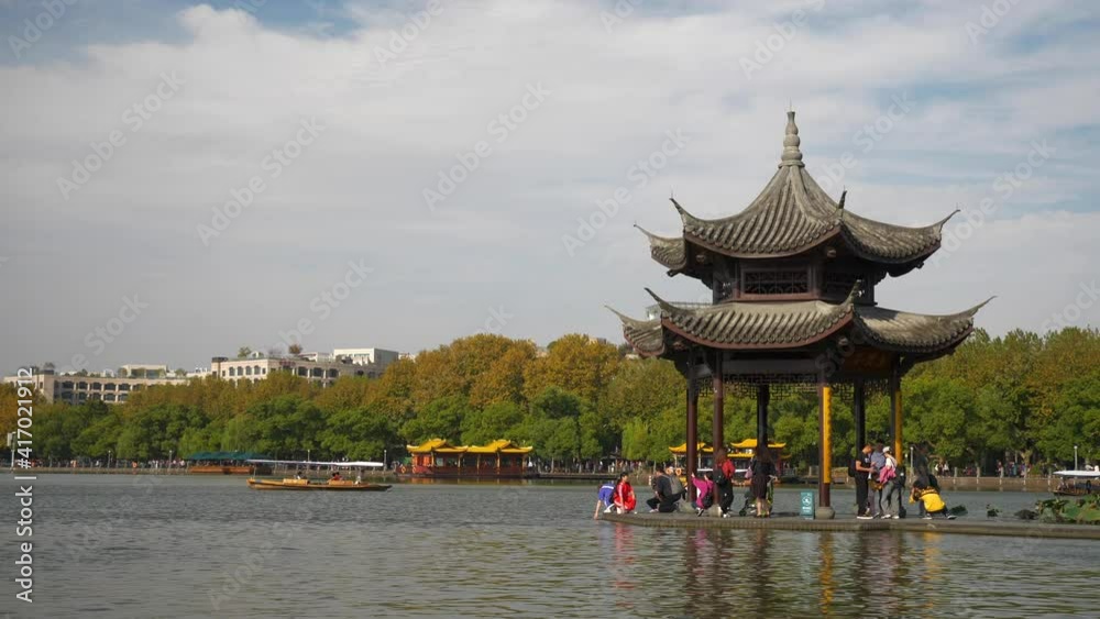hangzhou city sunny day famous west lake bay crowded pier bay pagoda slow motion panorama 4k china