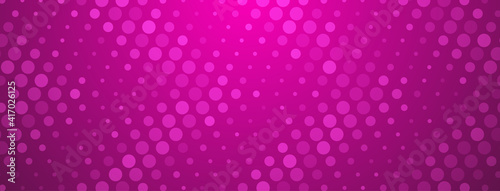 Abstract halftone background made of dots of different sizes in purple colors