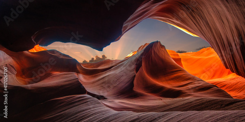 Panorama beautiful wide angle view of amazing sandstone formations in famous Antelope Canyon on a sunny day with blue sky near the old town of Page at Lake Powell, American Southwest, Arizona, USA