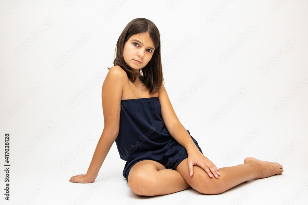 Girl, schoolgirl meditates, expresses emotions, close-up on a white background Girl, schoolgirl meditates, expresses emotions, close-up on a white background