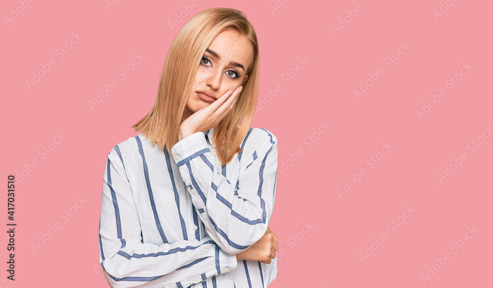 Beautiful caucasian woman wearing casual clothes thinking looking tired and bored with depression problems with crossed arms. Beautiful caucasian woman wearing casual clothes thinking looking tired and bored with depression problems with crossed arms.