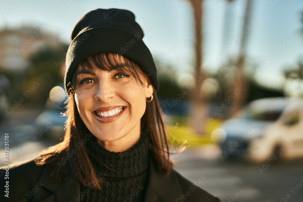 Young hispanic woman smiling happy standing at the city. Young hispanic woman smiling happy standing at the city.