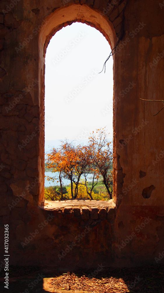 View through a window sill at the ruins of an old missionary church close to Kilifi, Tanzania