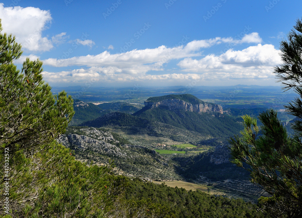 Spectacular View From The Summit Of Mount L'Ofre To The Mount Puig d'Alaro In The Tramuntana Mountains On Balearic Island Mallorca On A Sunny Winter Day With A Few Clouds In The Sky