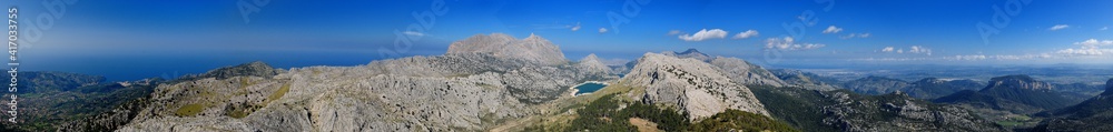 Spectacular Panorama View From The Summit Of Mount L'Ofre To The Puig Major And Lake Cuber In The Tramuntana Mountains On Balearic Island Mallorca On A Sunny Winter Day With A Clear Blue Sky