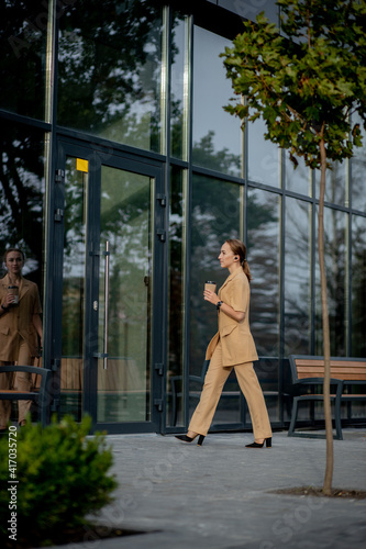 Business Women Style. Woman with Briefcase Going To Work. Portrait Of Beautiful Smiling Female In Stylish Office Clothes. High Resolution. © volody10