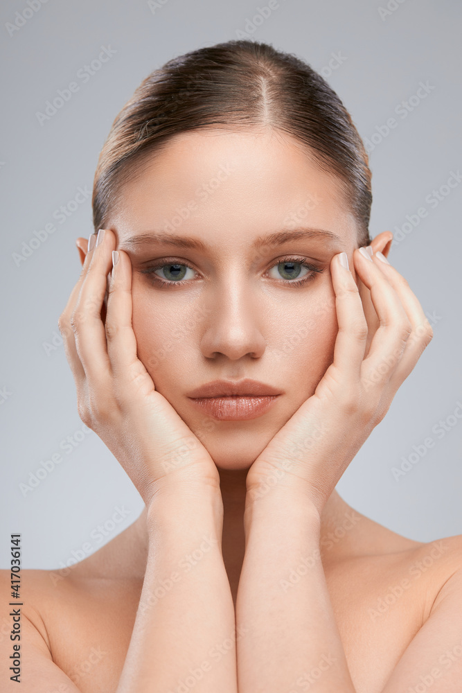 Gorgeous young woman posing with nude makeup. Beauty photography Gorgeous young woman posing with nude makeup. Beauty photography