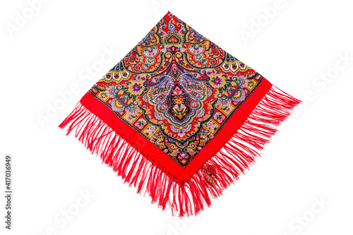 top view flat lay on bright red cotton scarf with fringe and ethnic paisley ornament