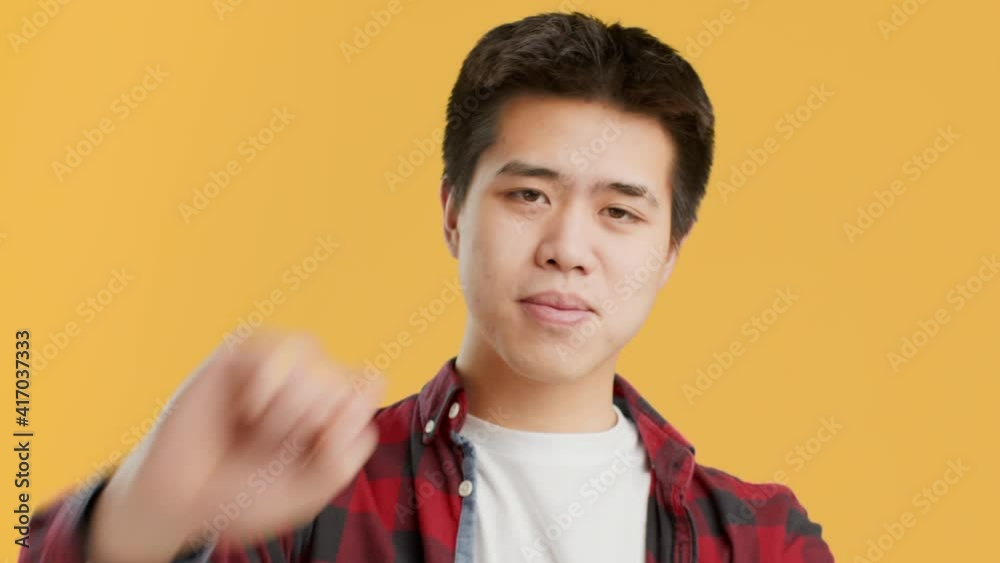 Asian Guy Capturing Moment Framing Face With Fingers, Yellow Background Asian Guy Capturing Moment Framing Face With Fingers, Yellow Background