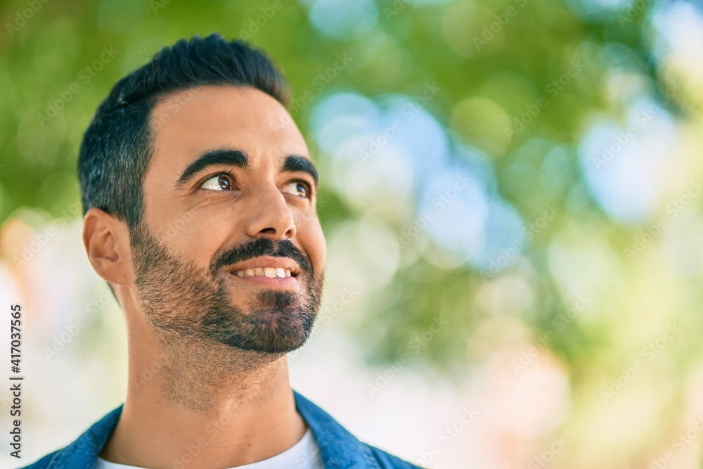 Young hispanic man smiling happy standing at the park Young hispanic man smiling happy standing at the park