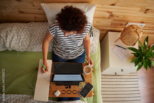 Woman teleworking from her room photo