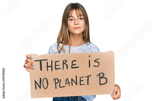 Teenager caucasian girl holding there is no planet b banner thinking attitude and sober expression looking self confident © Krakenimages.com