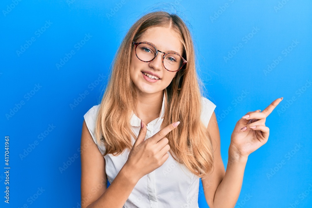 Beautiful young caucasian girl wearing casual clothes and glasses smiling and looking at the camera pointing with two hands and fingers to the side. Beautiful young caucasian girl wearing casual clothes and glasses smiling and looking at the camera pointing with two hands and fingers to the side.