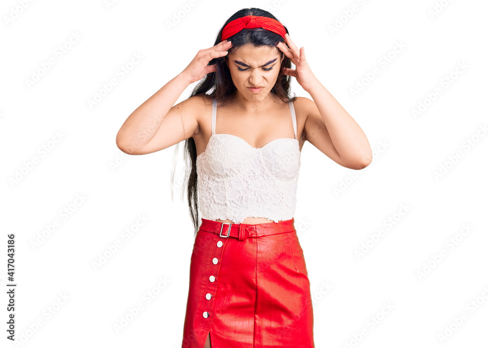Brunette teenager girl wearing elegant look with hand on head for pain in head because stress. suffering migraine. Brunette teenager girl wearing elegant look with hand on head for pain in head because stress. suffering migraine.