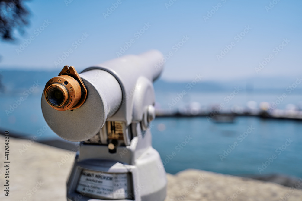 Coin Operated Spyglass viewer next to the waterside promenade looking out to the bay. Coin Operated Spyglass viewer next to the waterside promenade looking out to the bay.