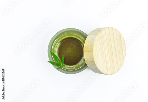 Full Spectrum CBD cannabis alternative medicine skincare cream in glass jar isolated on white