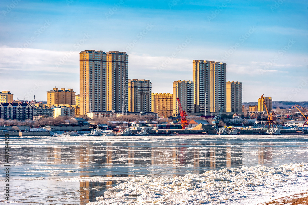 city skyline of heihe by the amur river / view from Blagoveshchensk city