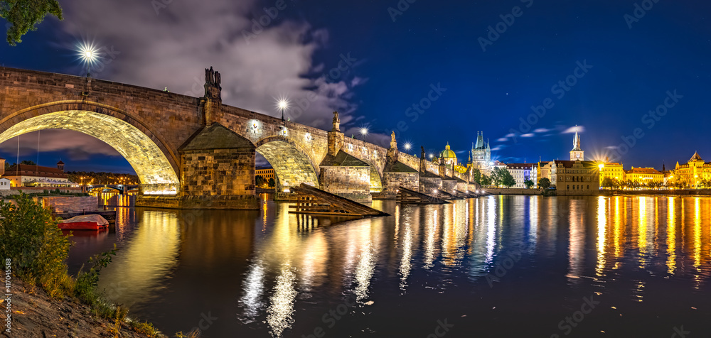 Illuminated Stone Arches of Charles Bridge, Medieval Gothic Architecture, Part of the Cultural Heritage of Prague