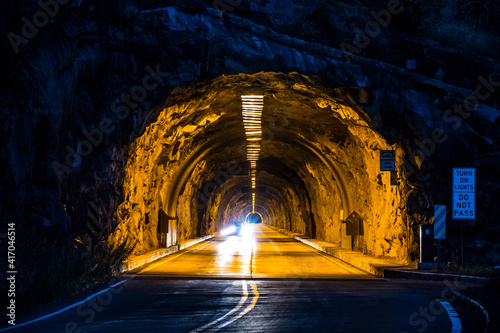 The Wawona tunnel illuminated at night in Yosemite National park in california. photo