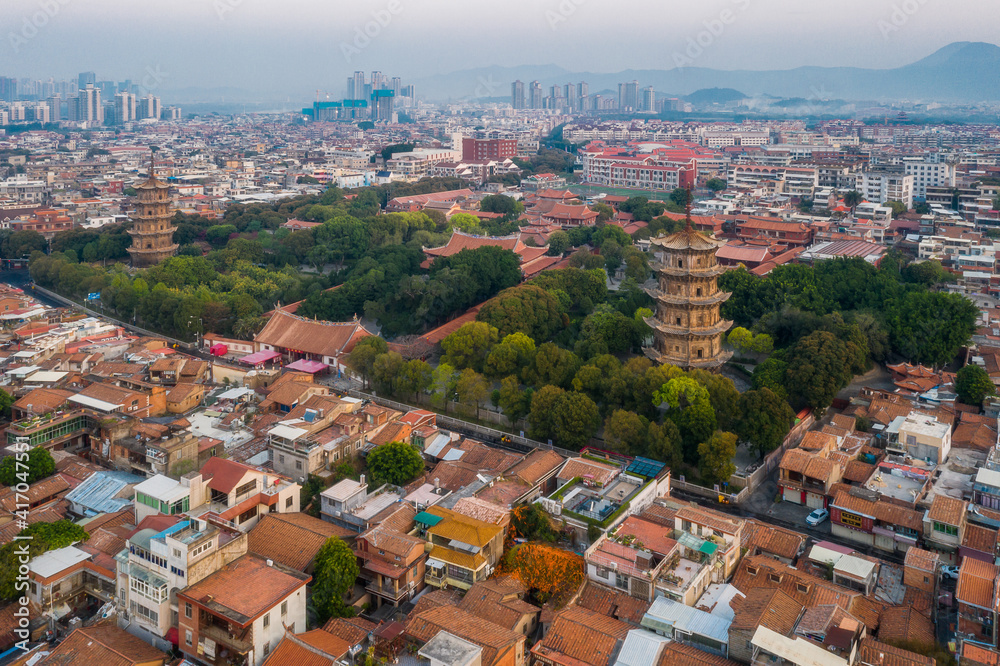 Aerial view of Kaiyuan Temple, the largest buddhist temple in Fujian Province, and West Street at dusk in Quanzhou, China