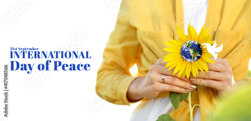 Young woman with sunflower ...