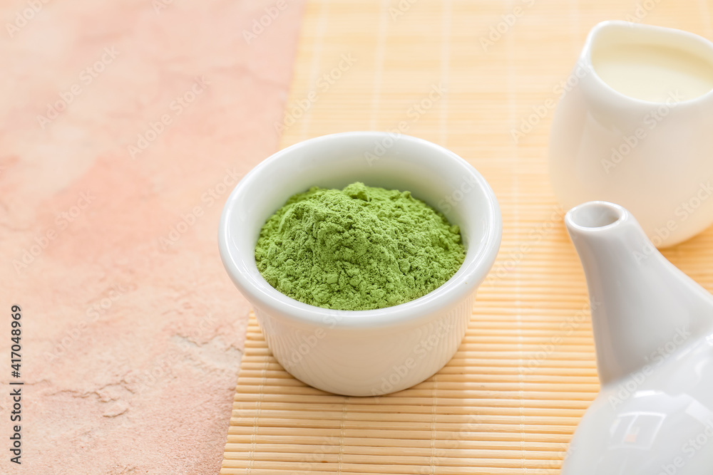 Bowl with powdered matcha tea on color background Bowl with powdered matcha tea on color background