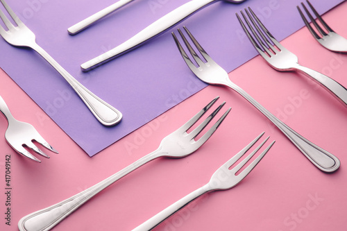 Stylish forks on color background © Pixel-Shot