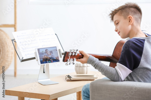 Little boy taking music les...