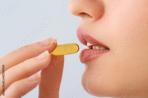 Beautiful young woman takin...