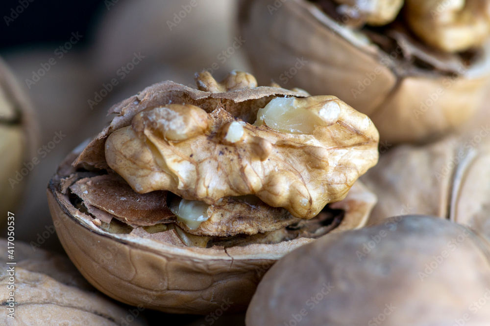 walnuts on a wooden table walnuts on a wooden table