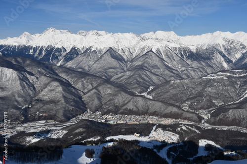 Beautiful snow landscape of snowy trees and ski slope of Roza Khutor ski resort