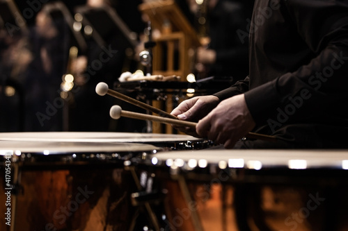 Hands of a musician playing the timpani photo