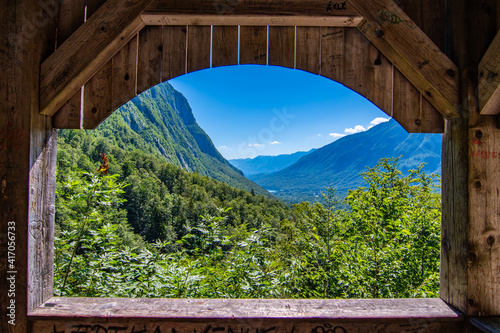 Landscape view from Savica waterfall to Bohnij valley and Bohnij lake visible in distance, Slovenia, wooden booth view photo