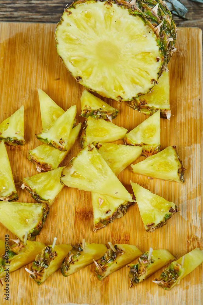 Close up slices of pineapple on wooden board Close up slices of pineapple on wooden board